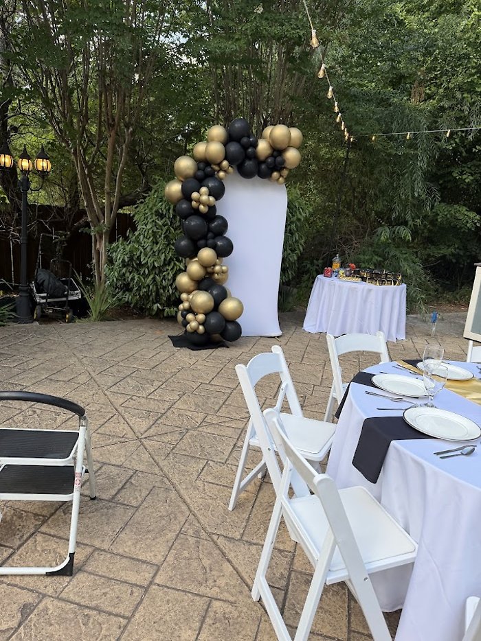 U-Shaped Backdrop with Black and Gold Balloon Garland