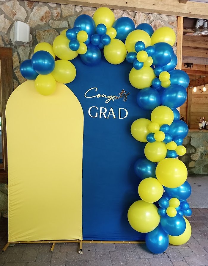 U-Shaped Backdrop with Blue and Yellow Garland